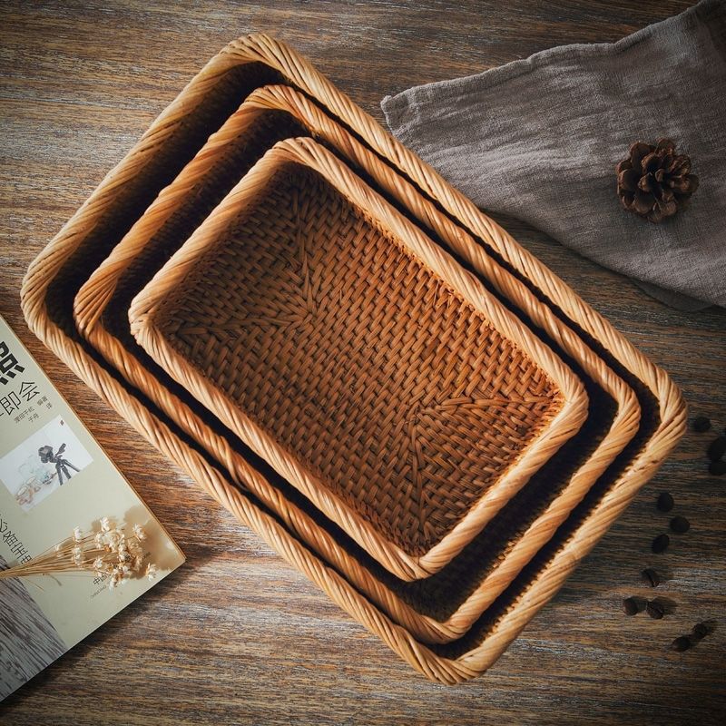 Top view of three nested rectangular rattan storage baskets