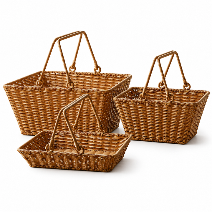 Three woven picnic baskets with dual handles on a white background